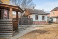 scenery of old houses with windows. Sign: Canned